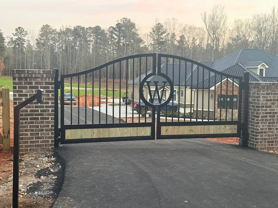 Custom driveway gate with monogram W design